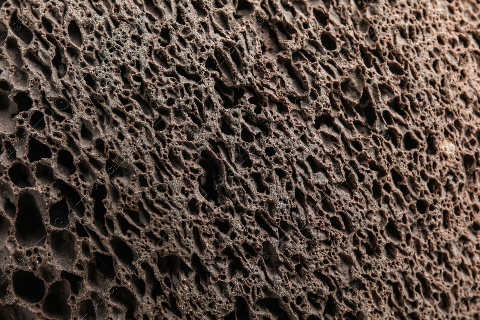 Photo of Texture of pumice stone as background, closeup