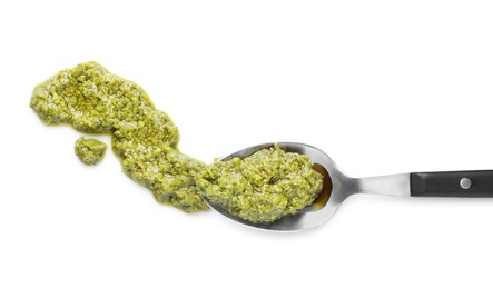 Photo of Sample of tasty pesto sauce and spoon isolated on white, top view