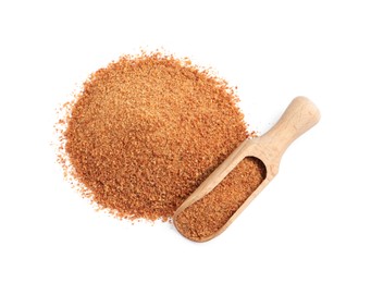 Photo of Natural coconut sugar and wooden scoop on white background, top view