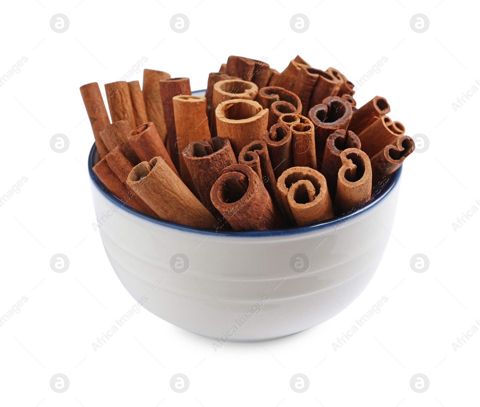 Photo of Cinnamon sticks in bowl isolated on white