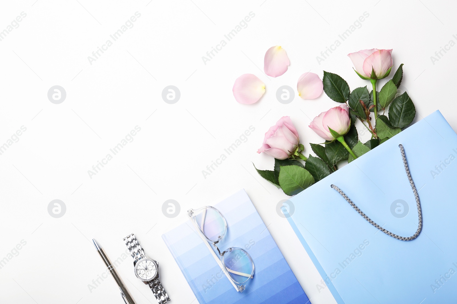 Photo of Stylish flat lay composition with shopping bag on white background