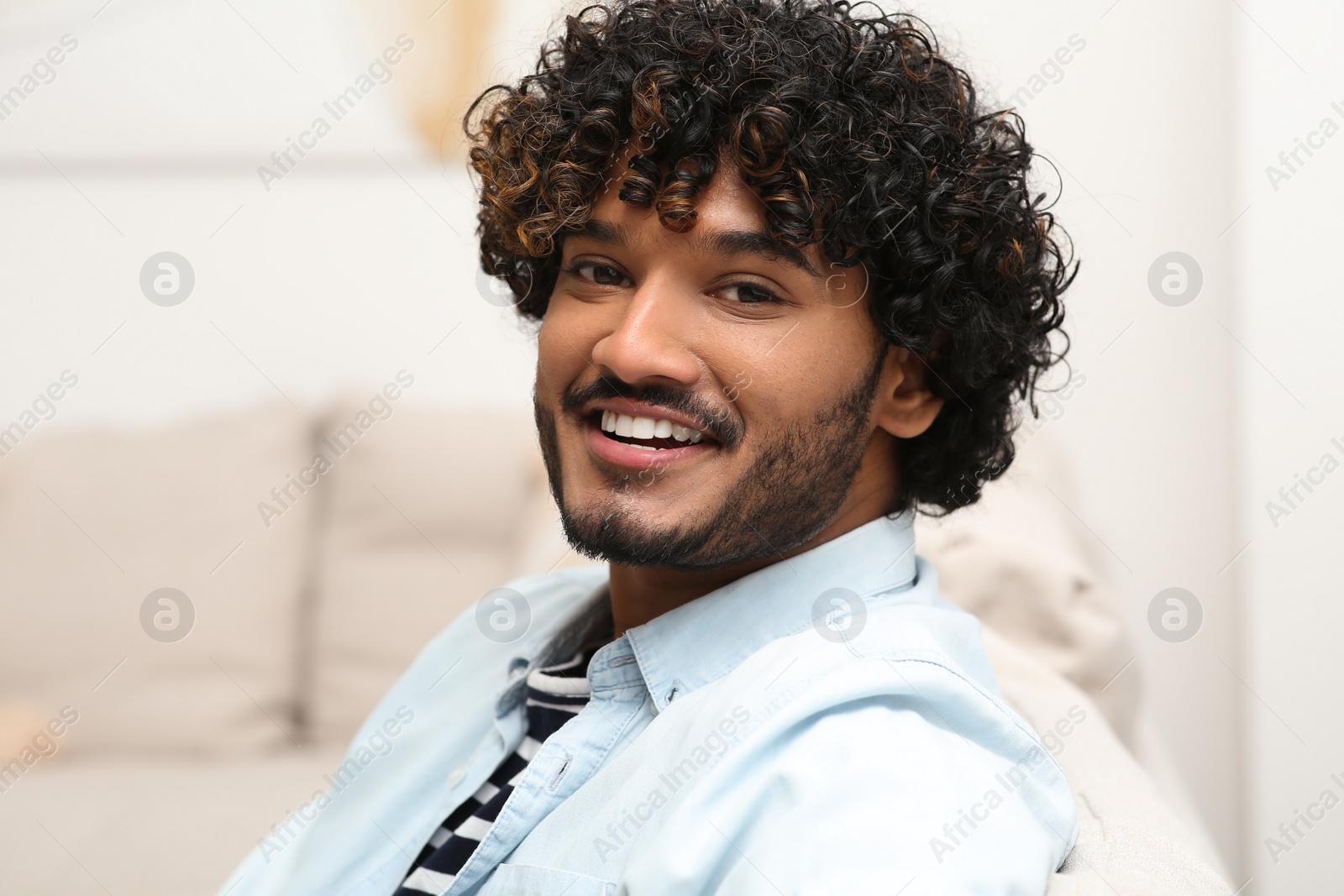 Photo of Portrait of handsome smiling man in room