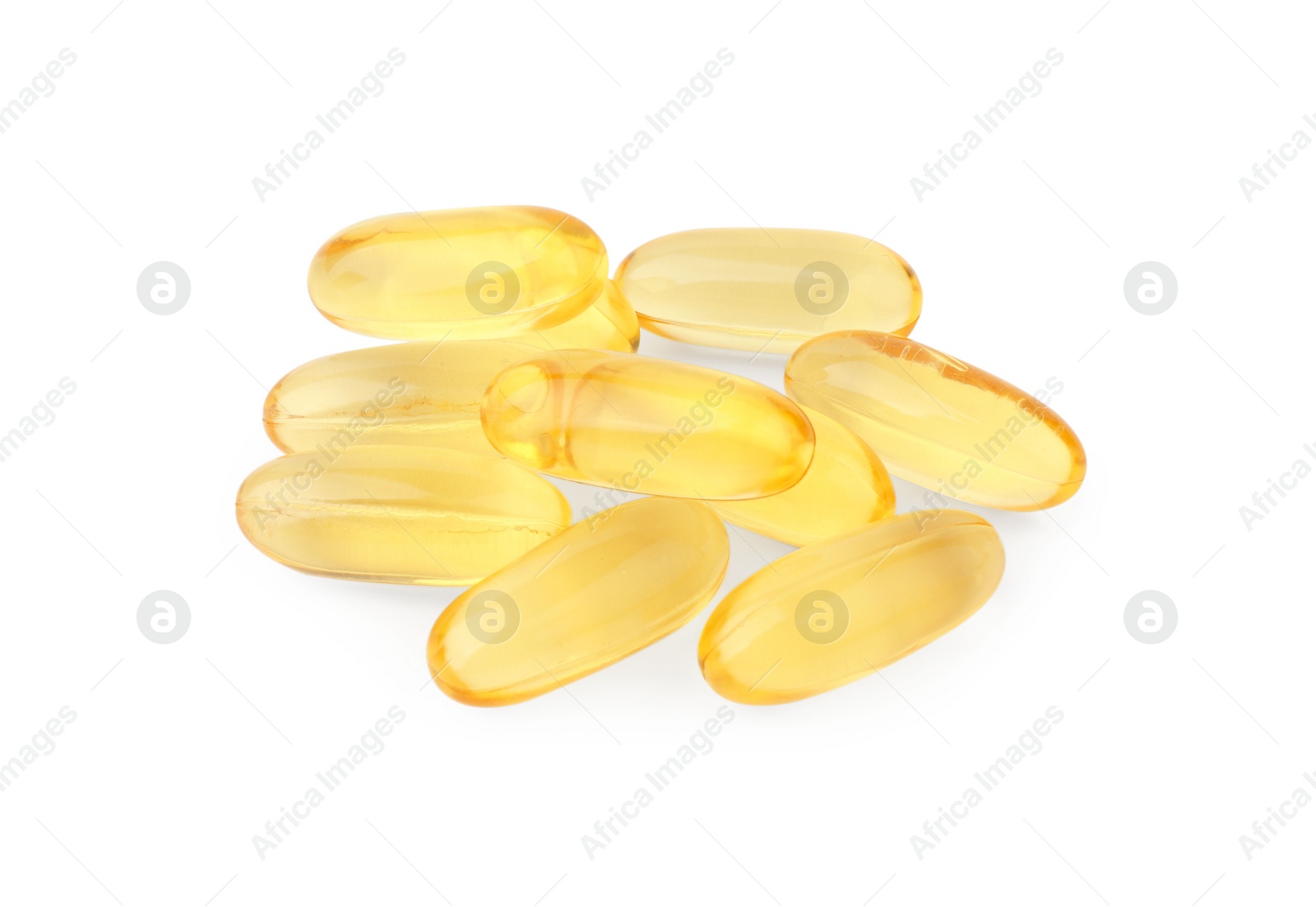 Photo of Many yellow vitamin capsules isolated on white