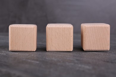 Photo of International Organization for Standardization. Cubes with abbreviation ISO on gray textured table