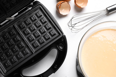 Flat lay composition with ingredients for cooking Belgian waffles on white table