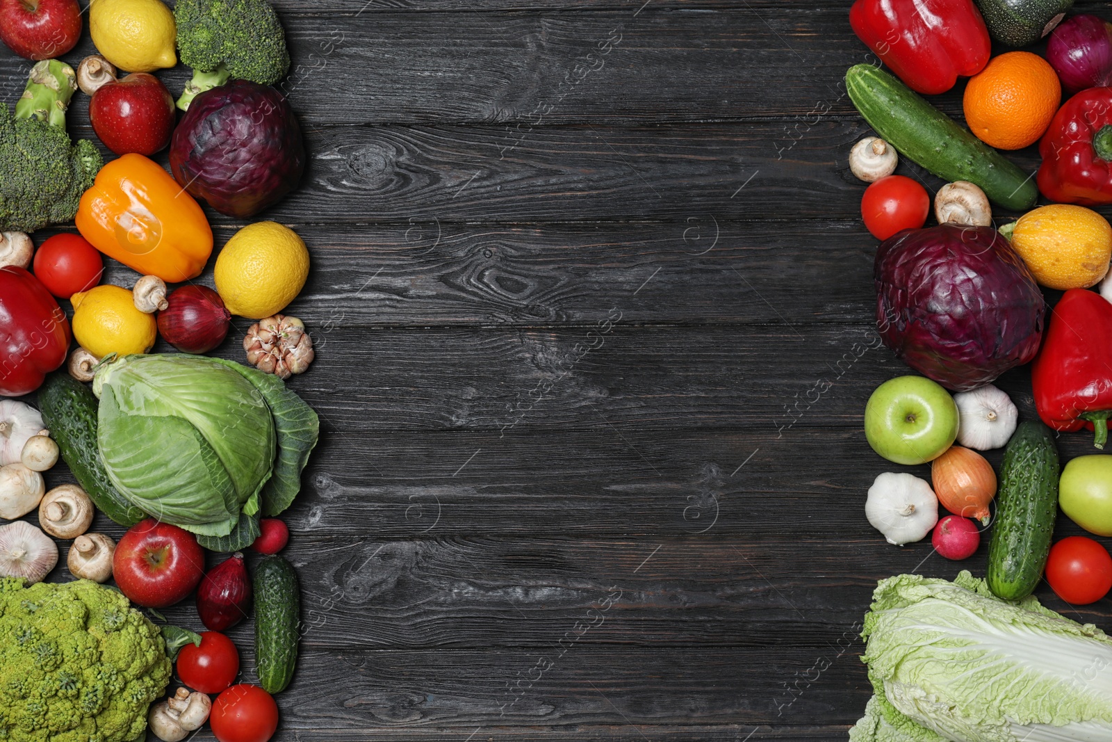 Photo of Frame made of ripe fruits and vegetables on black wooden background, flat lay. Space for text