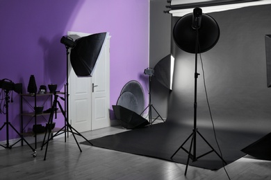 Photo of Interior of modern photo studio with professional equipment