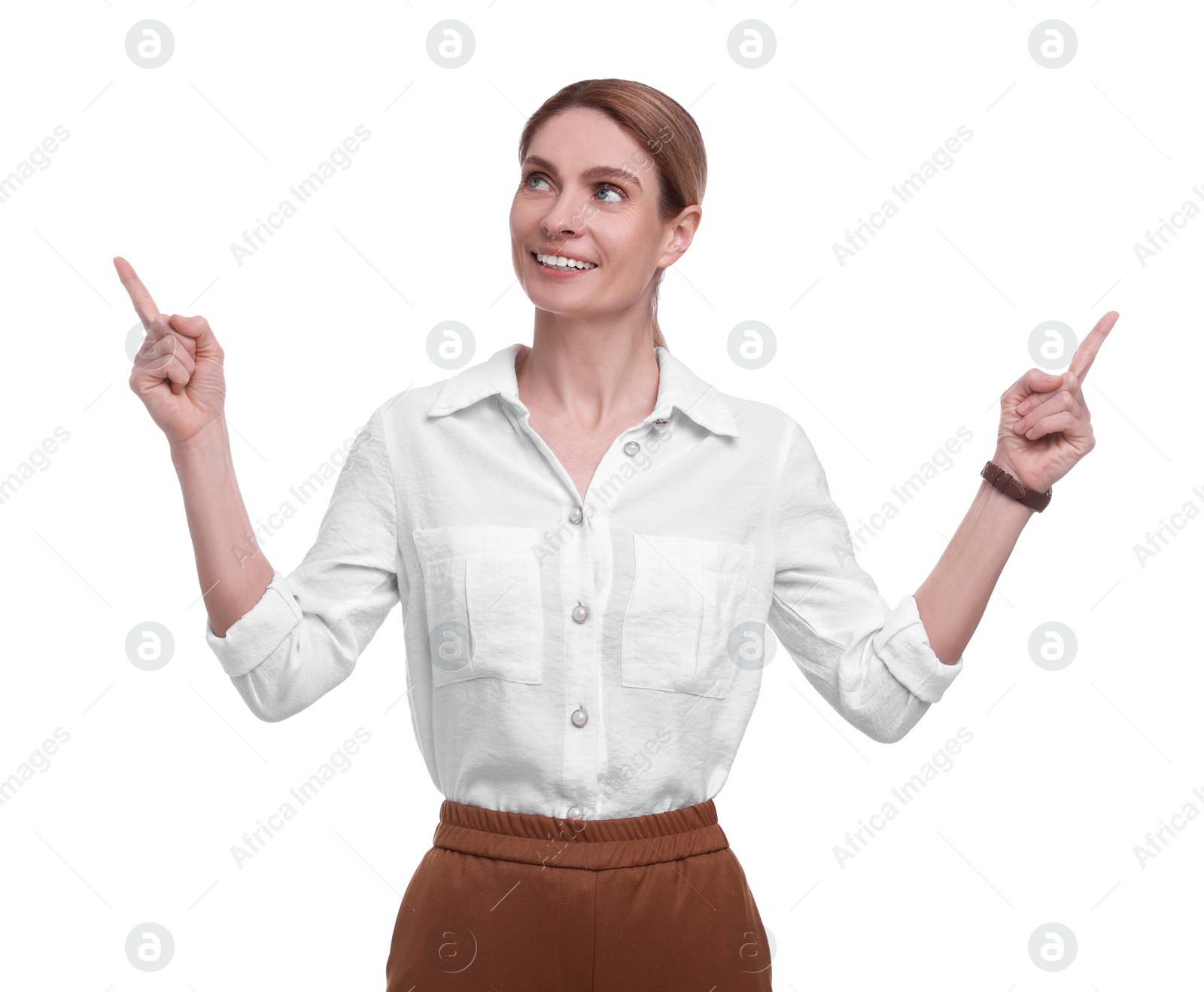 Photo of Beautiful happy businesswoman pointing at something on white background