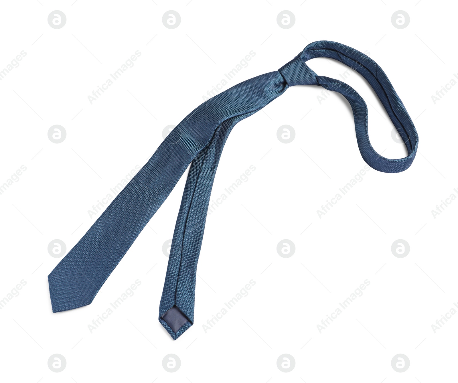 Photo of One blue necktie isolated on white, top view