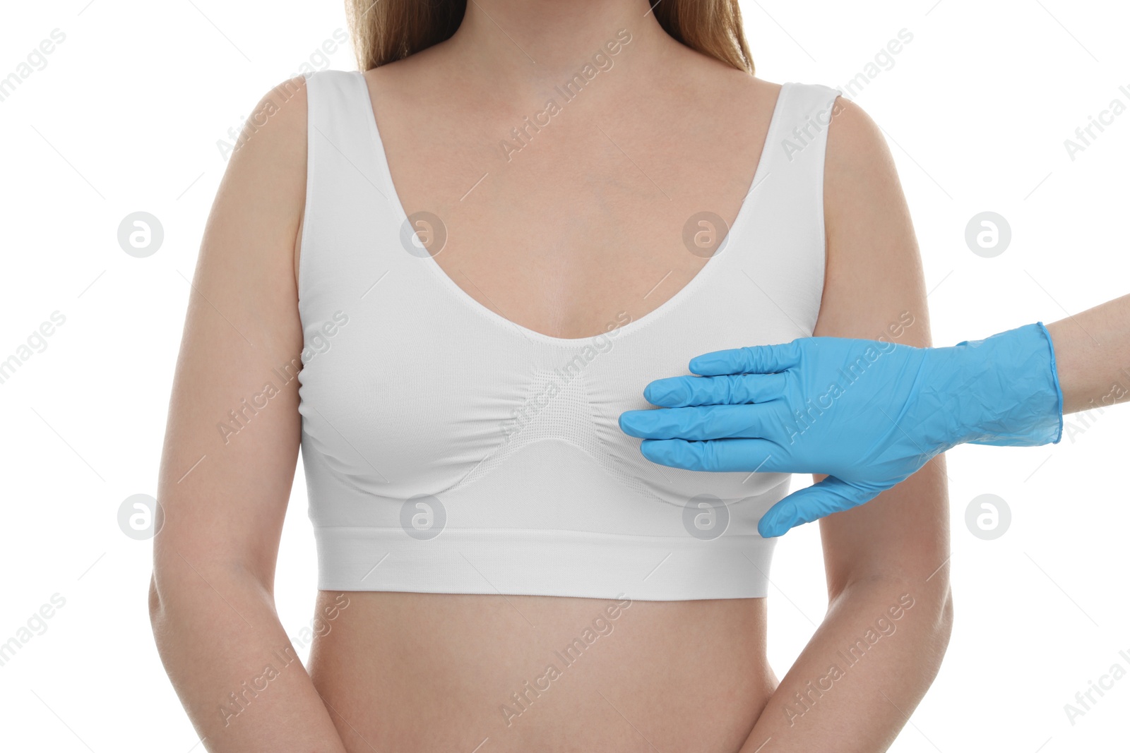 Photo of Mammologist checking woman's breast on white background, closeup