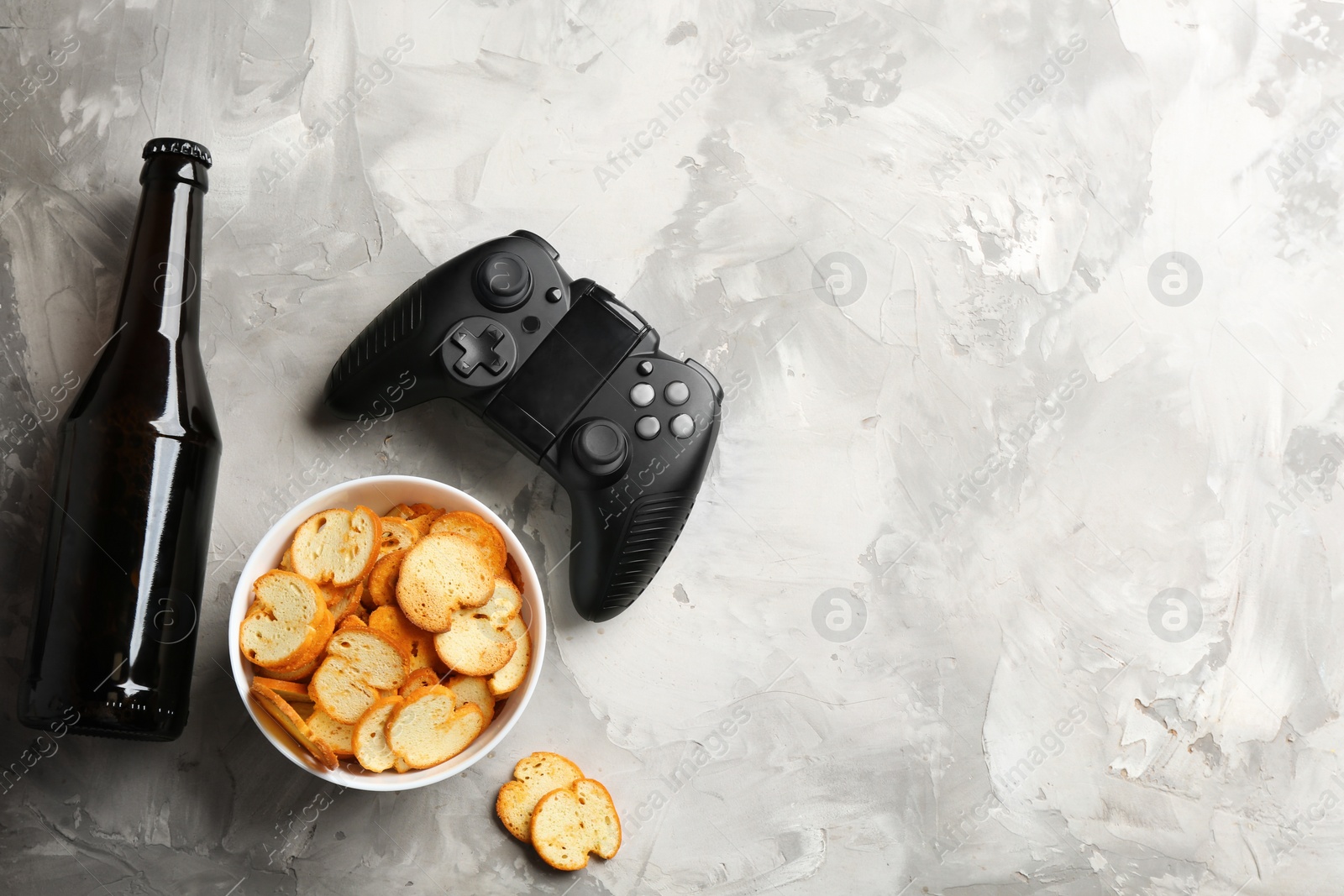 Photo of Flat lay composition with video game controller and space for text on grey background