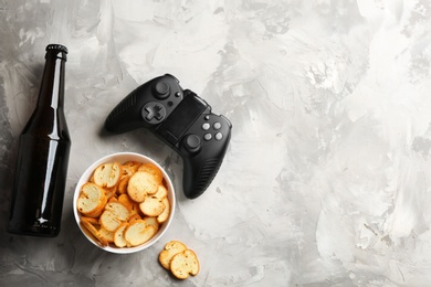 Photo of Flat lay composition with video game controller and space for text on grey background