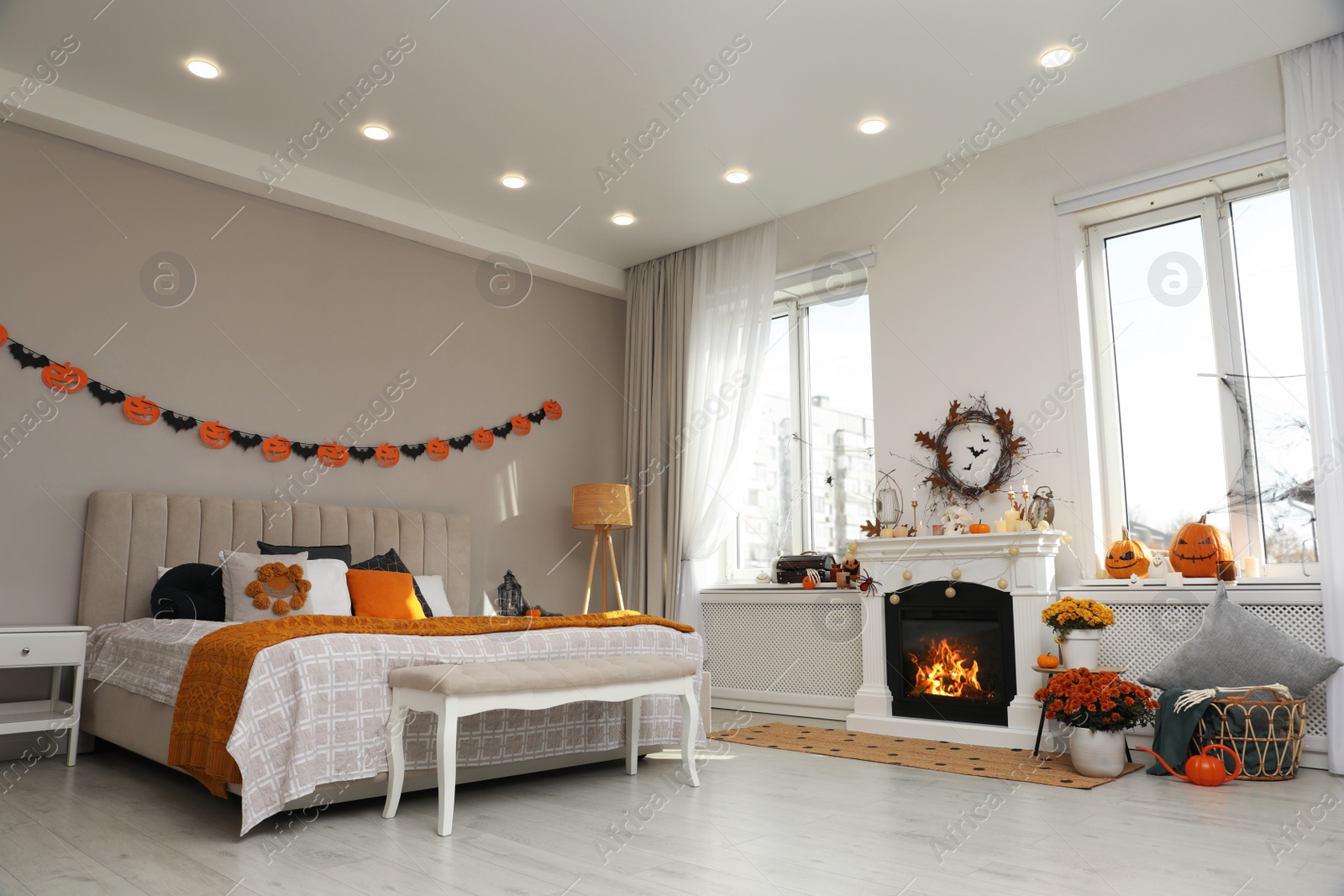 Photo of Modern bedroom decorated for Halloween. Festive interior