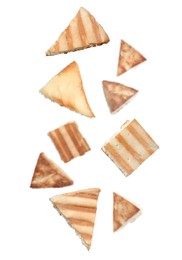 Image of Delicious crispy pita chips falling on white background