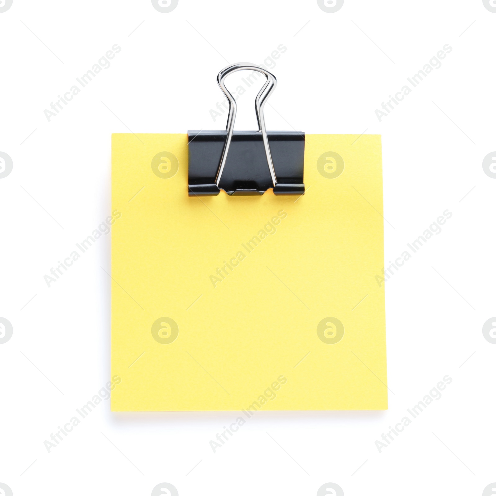 Photo of Blank orange note with black paper clamp isolated on white. Space for text