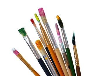 Photo of Different brushes with paints on white background