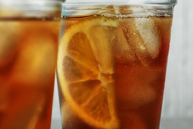 Photo of Glasses of delicious refreshing iced tea, closeup