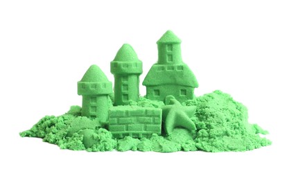 Castle figures and starfish made of green kinetic sand isolated on white