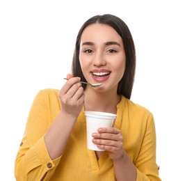 Photo of Happy woman eating tasty yogurt on white background