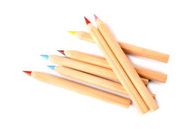 Photo of Different color pencils on white background, top view. School stationery