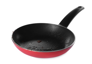 Photo of Dirty red frying pan isolated on white