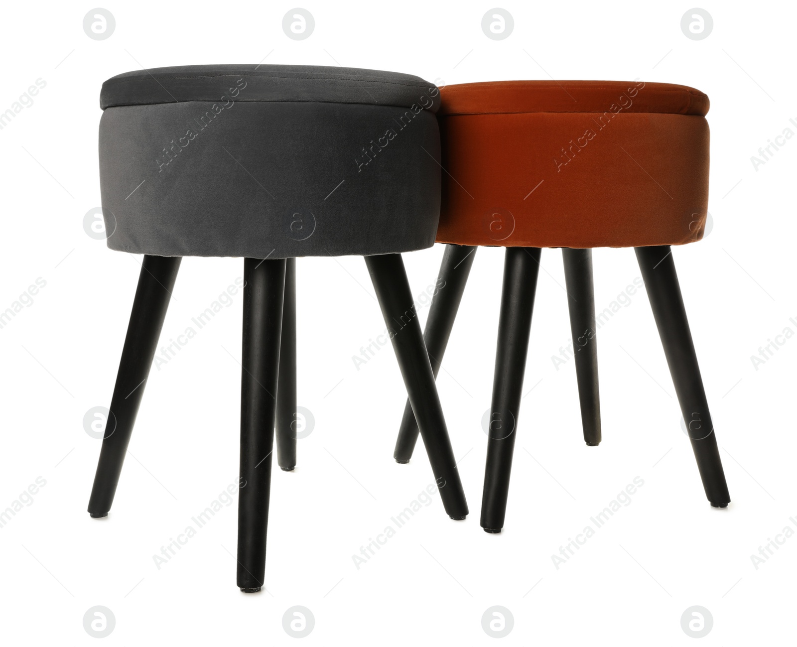 Photo of Different stylish velvet stools on white background