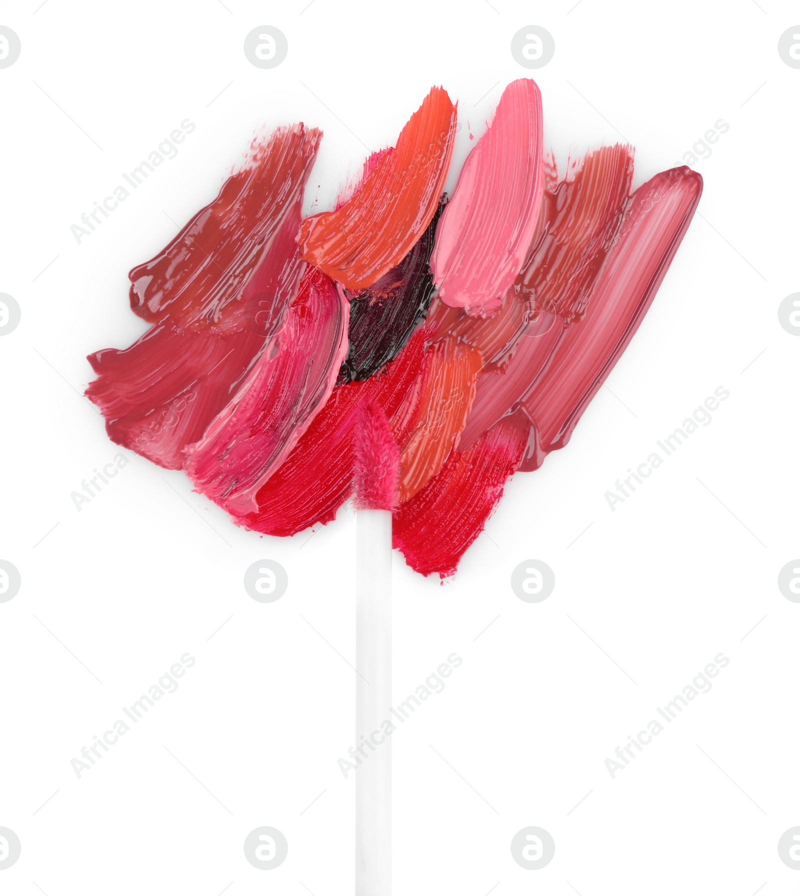 Photo of Strokes of different lip glosses and applicator isolated on white, top view