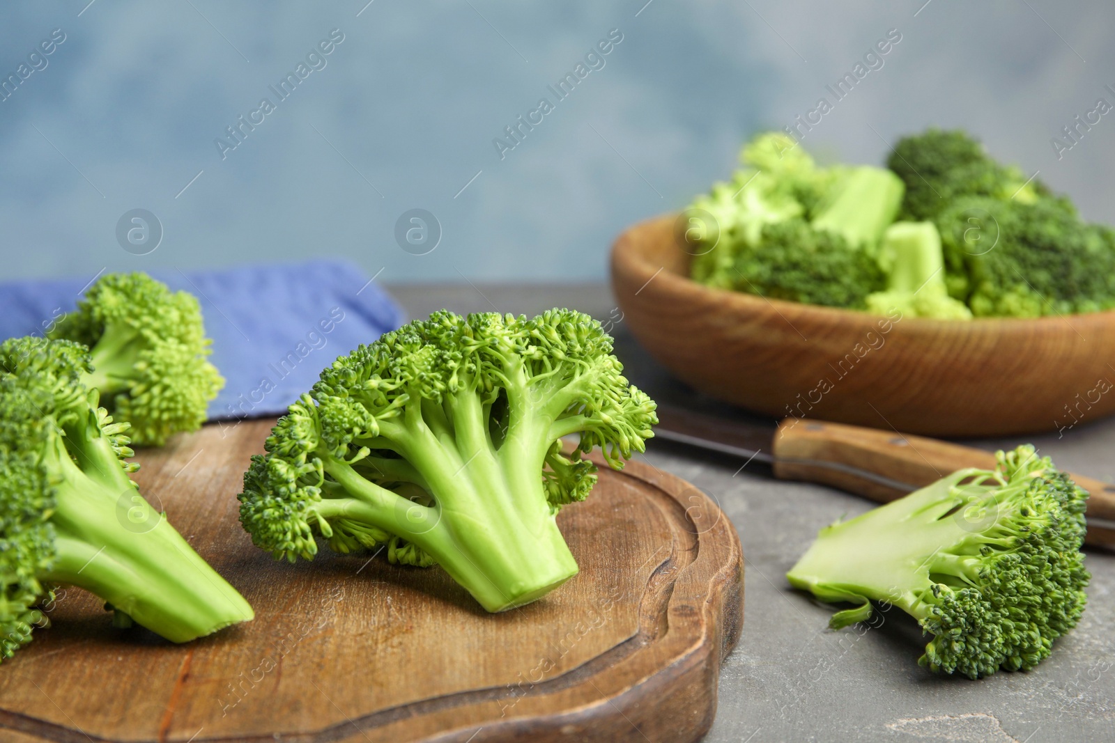 Photo of Fresh green broccoli on grey table. Organic food