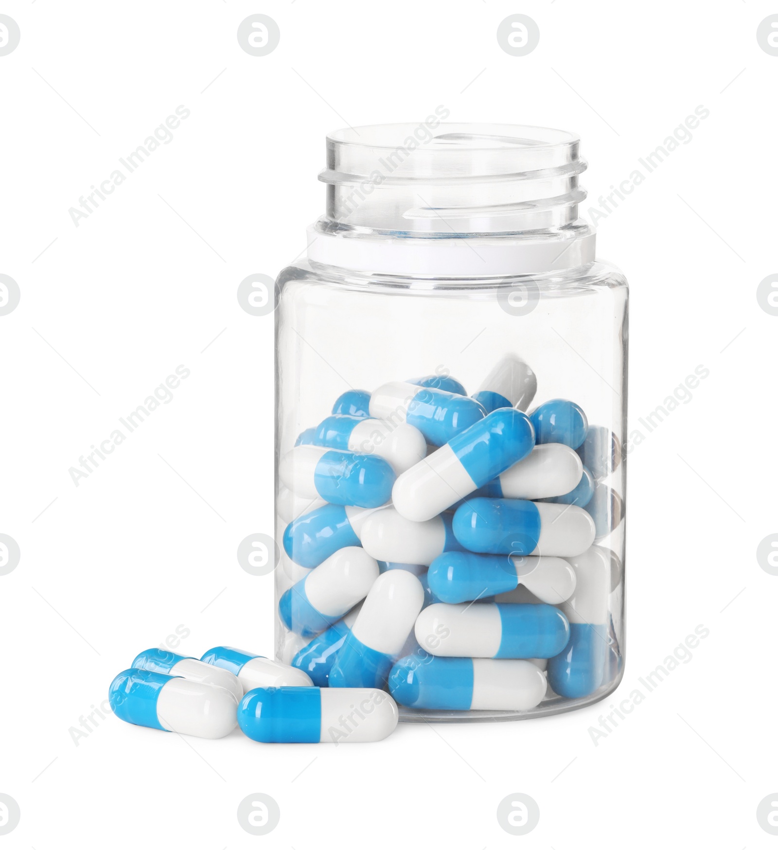 Photo of Antibiotic pills and bottle isolated on white