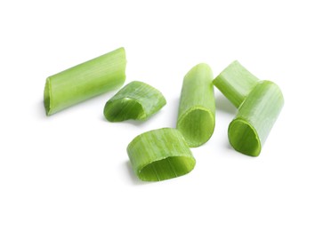 Pieces of fresh green onion on white background