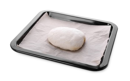 Photo of Baking pan with parchment paper and dough isolated on white