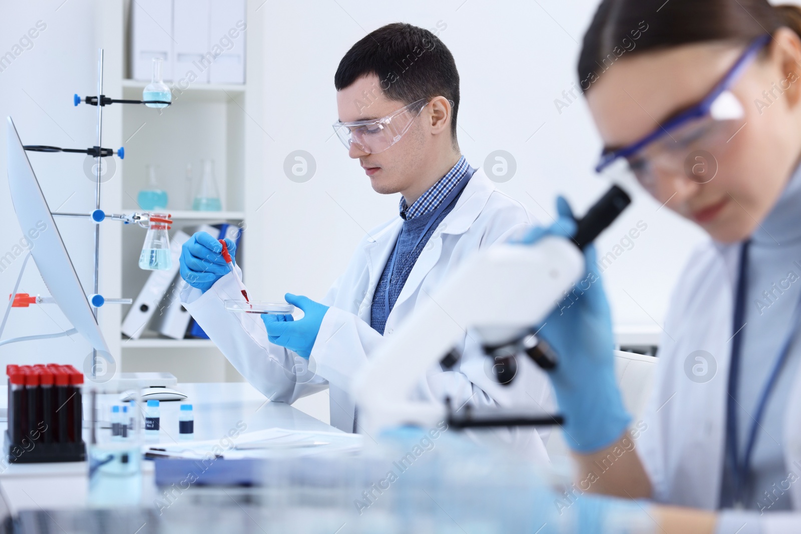 Photo of Scientists working with samples in laboratory. Medical research