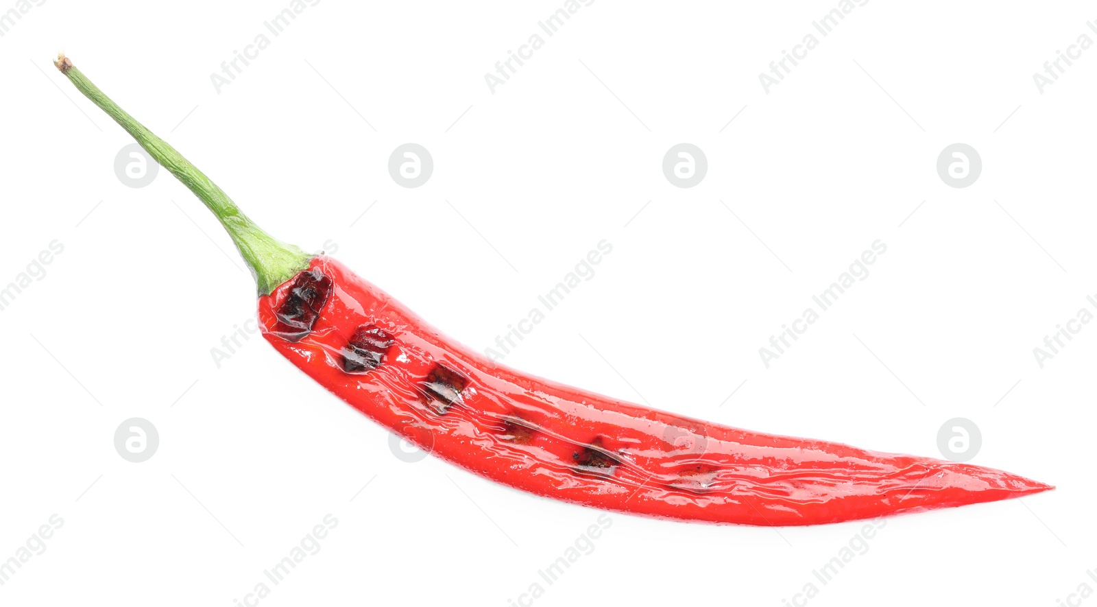 Photo of One grilled chili pepper isolated on white, top view