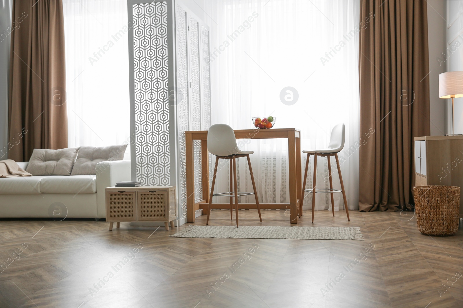 Photo of Modern living room with parquet floor and stylish furniture