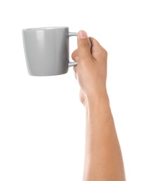 Photo of Woman holding light grey cup on white background, closeup