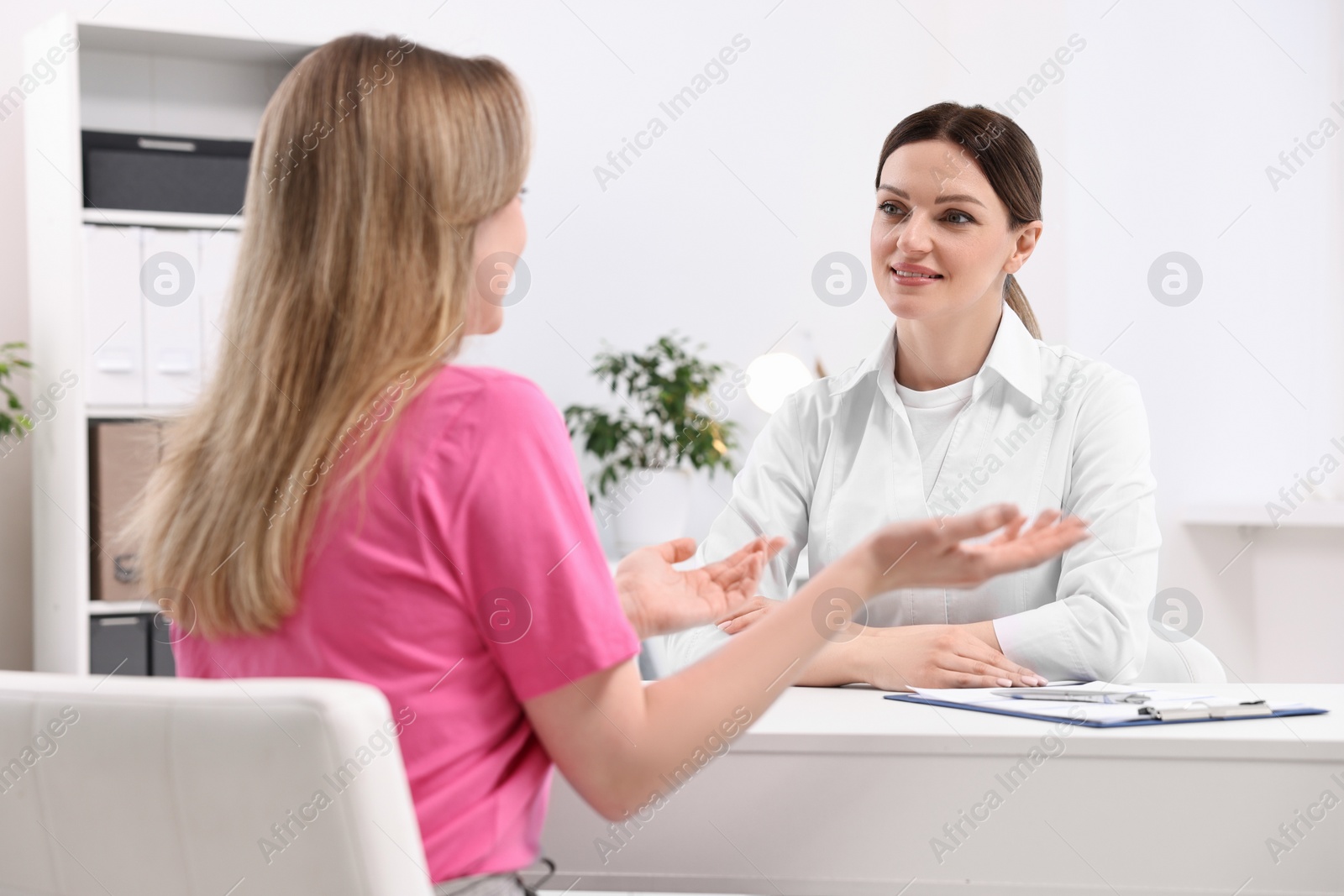 Photo of Mammologist consulting woman during appointment in hospital