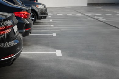 Photo of Outdoor parking lot with cars on sunny day