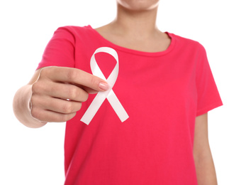 Photo of Woman holding pink ribbon on white background, closeup. Breast cancer awareness