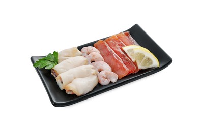 Photo of Sashimi set (raw slices of salmon, oily fish and shrimps) served with lemon and parsley isolated on white