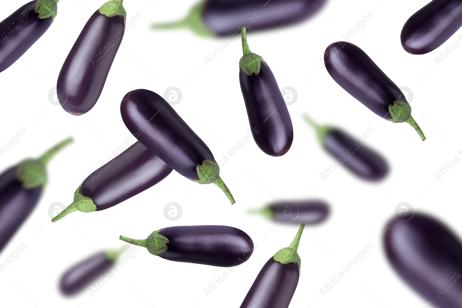 Image of Fresh whole eggplants falling on white background