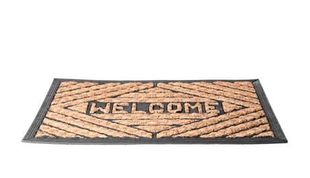 Photo of Brown welcome doormat with pattern isolated on white