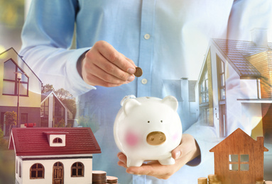 Image of Man putting coin into piggy bank for future house purchase, closeup