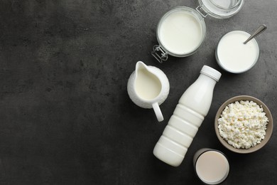 Photo of Many different lactose free dairy products on grey textured table, flat lay. Space for text