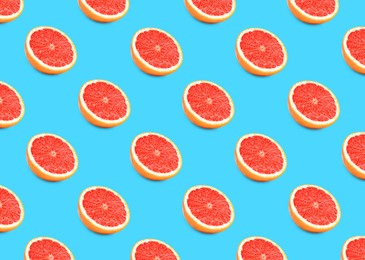 Image of Many fresh ripe grapefruits on turquoise background. Seamless pattern design