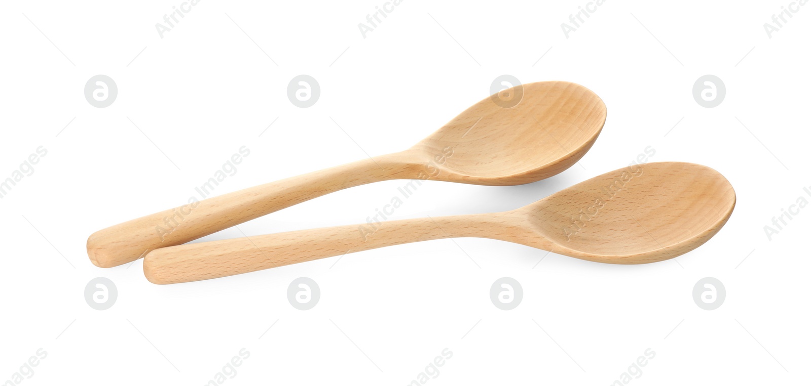 Photo of Two empty wooden spoons isolated on white