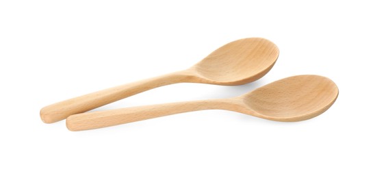 Photo of Two empty wooden spoons isolated on white