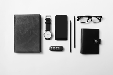 Photo of Flat lay composition with male accessories and remote car key on white background. Space for text