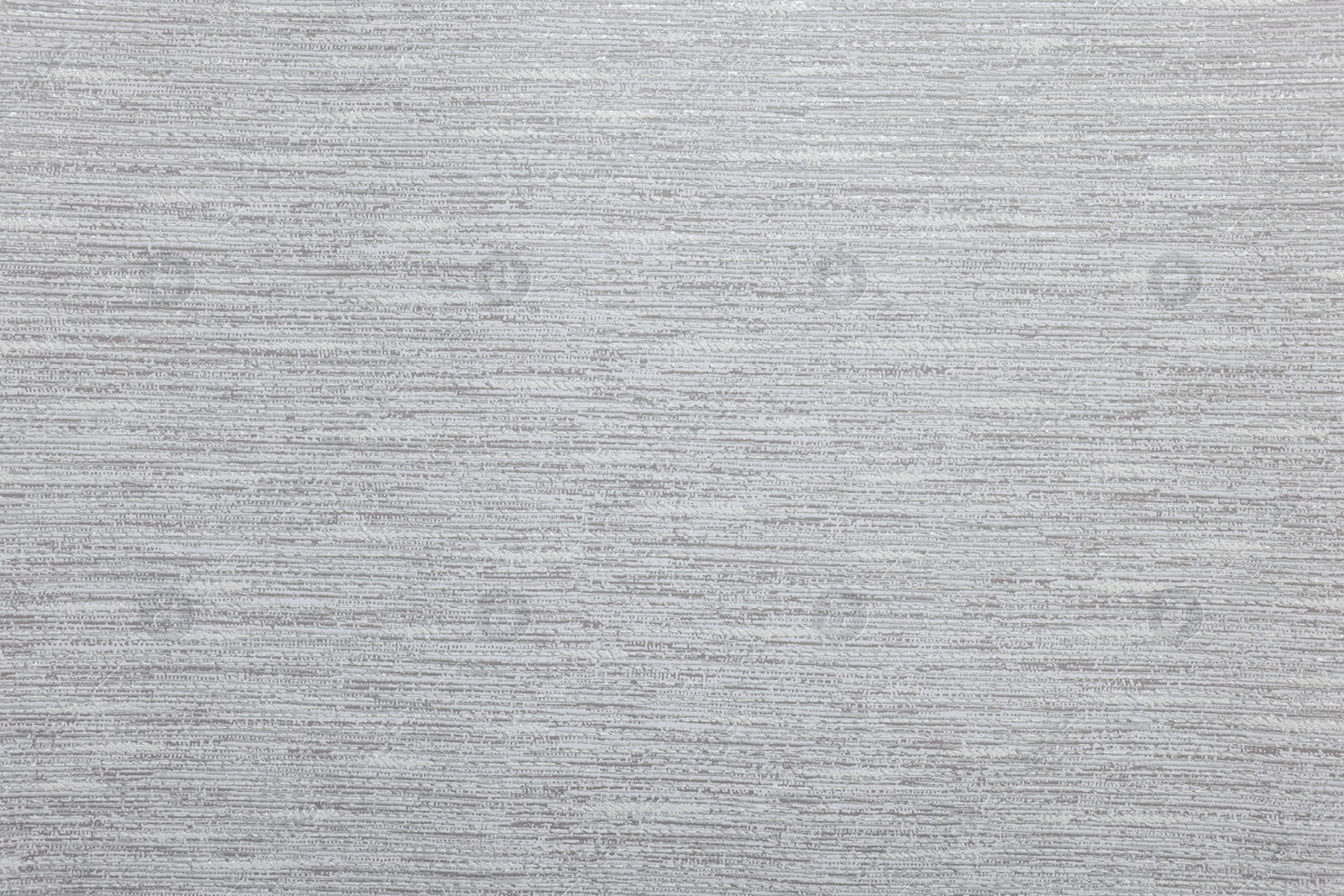 Photo of Stylish grey wallpaper as background, closeup view