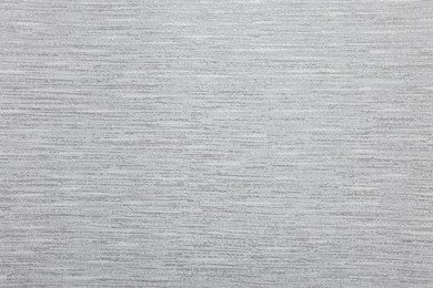 Stylish grey wallpaper as background, closeup view