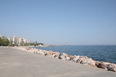 Photo of Beautiful view of modern buildings near sea on sunny day